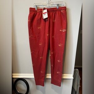 Nike Red Sweatpants with Mini Swoosh Pattern